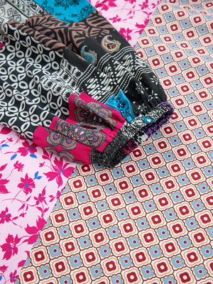 Boho floral print drop shoulder blouse with bubble sleeves in fuchsia pink and multi-color patchwork patterns.
