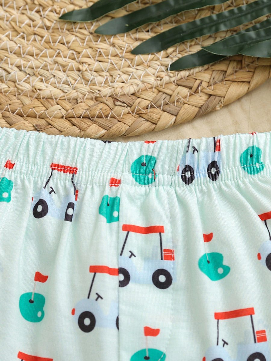 Baby shorts with elastic waistband and allover golf cart print in light green fabric.