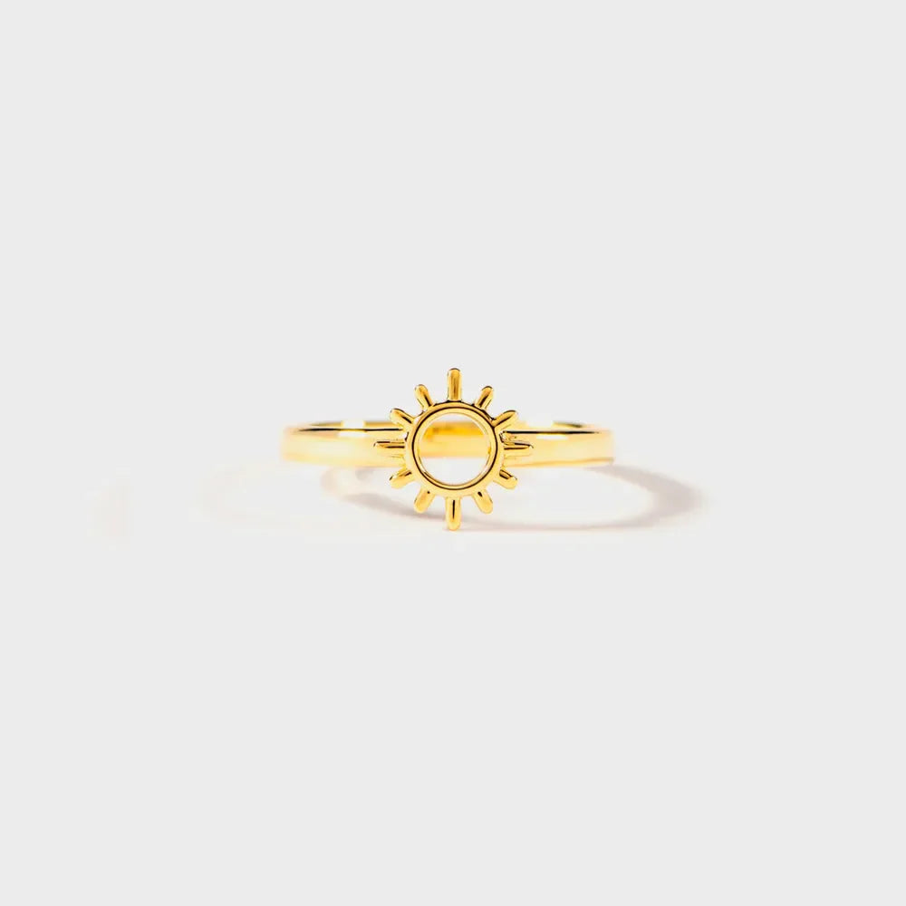 Gold sunburst signet ring with open center detail