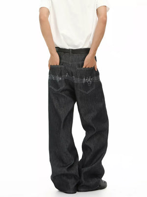 Loose fit dark wash denim jeans with embroidered musical notes on back pockets.