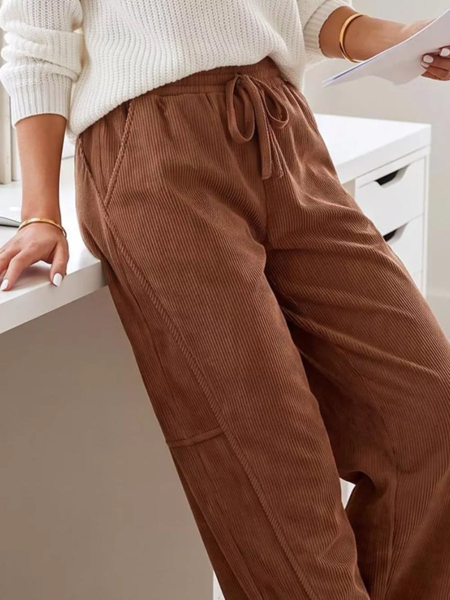 100% polyester Care instructions: Machine wash cold pants in Dark Brown with wide-leg silhouette