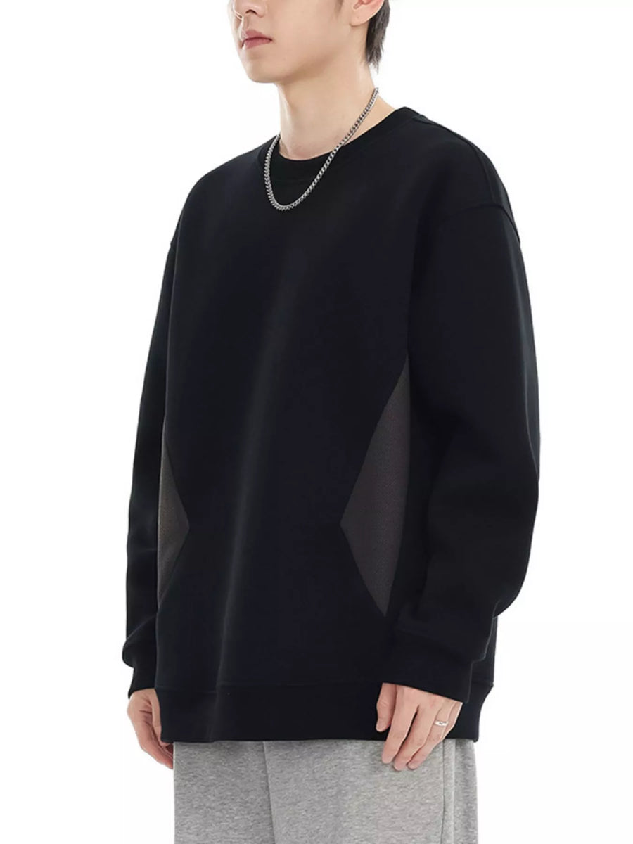 Oversized black cotton crew-neck sweatshirt with contrasting panel details on the sides.