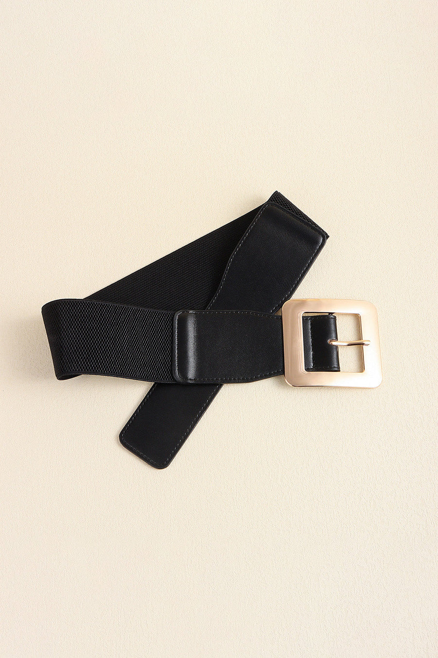 Black vegan leather belt with wide square gold buckle and elastic back.