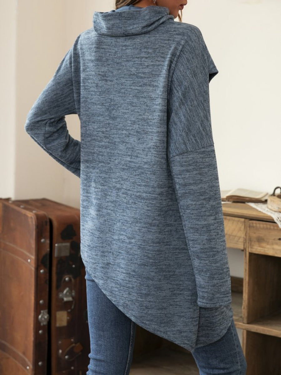 Dusty blue asymmetric knit sweater with cowl neck and long sleeves.