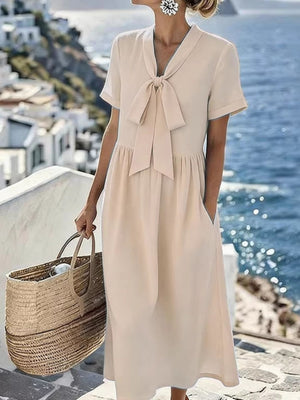100% polyester Care instructions: Machine wash cold midi dress in Apricot with A-line silhouette