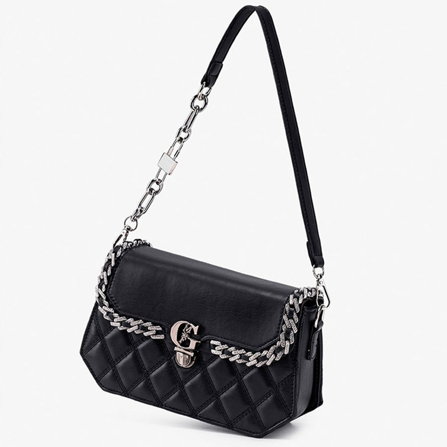 Black crossbody bag featuring quilted and quilted