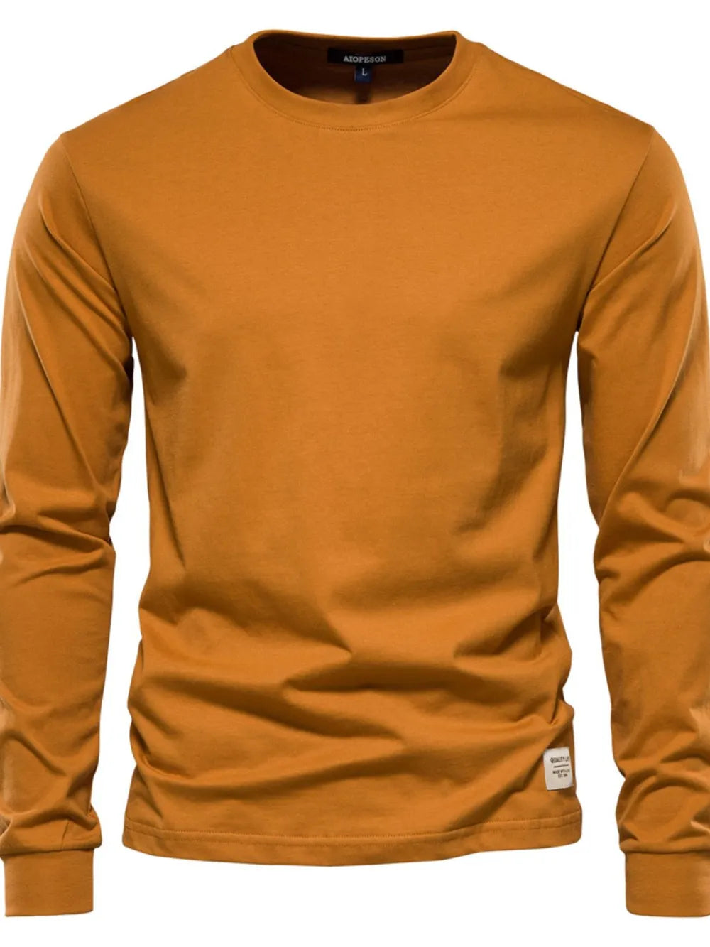 Essential crewneck long sleeve tee in caramel with a small tag detail on the hem.