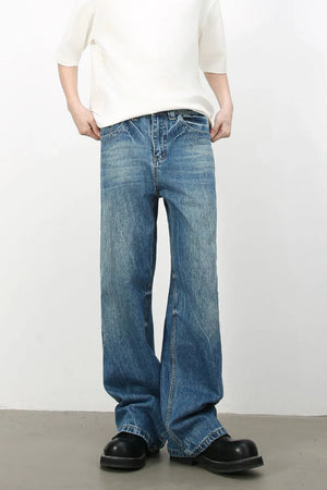 Baggy denim jeans in medium vintage wash with classic cat's whisker detailing.