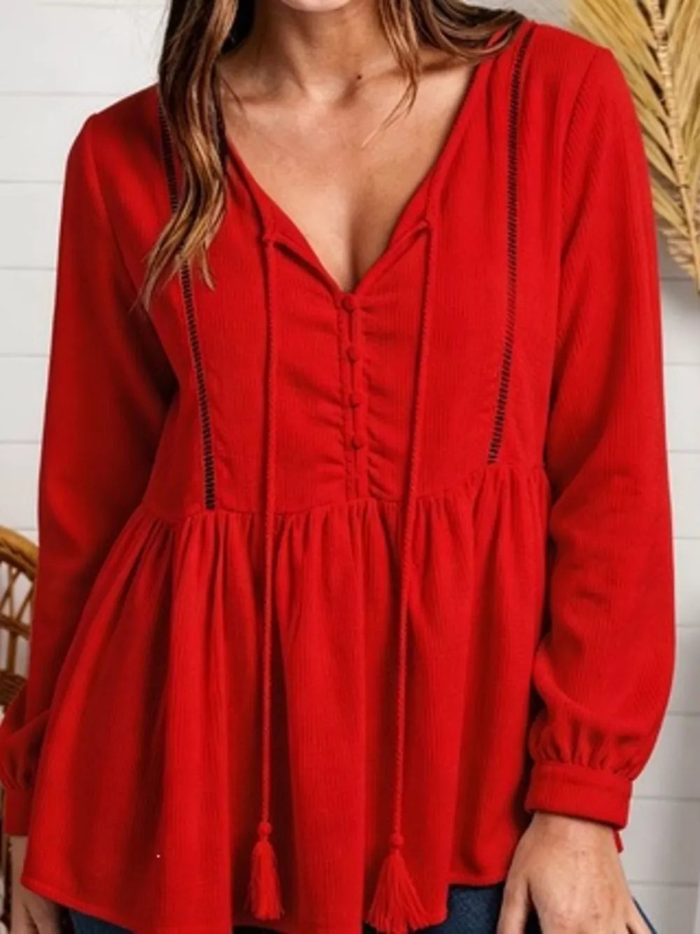 peplum top in Black with waffle-knit and hip-length