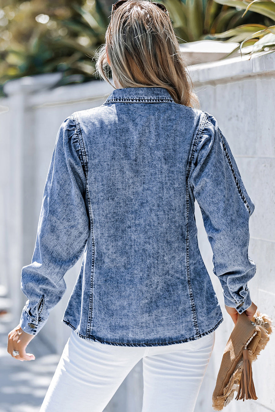 Acid wash denim shirt with puff sleeves and button cuffs, styled casually.