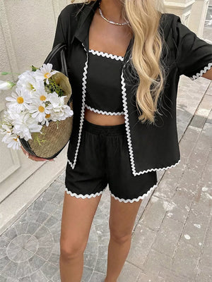Black cami shorts set with scalloped trim and matching cardigan.