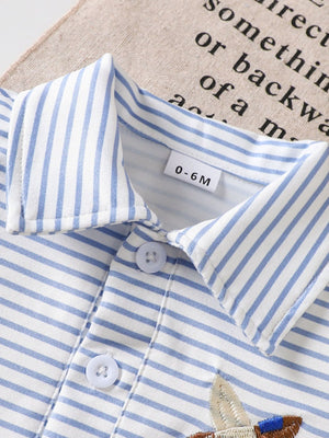 Baby polo shirt with blue and white stripes, classic collar, and embroidered duck detail.