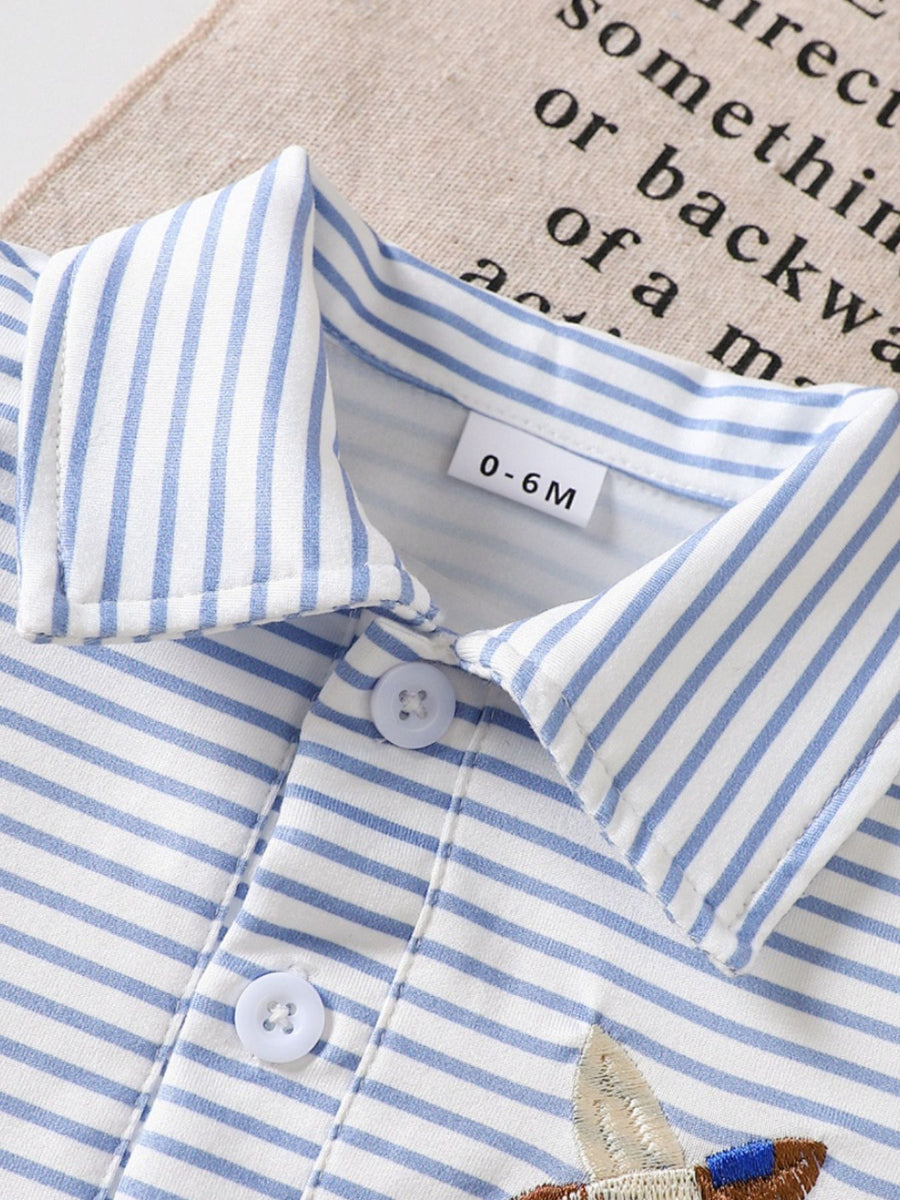 Baby polo shirt with blue and white stripes, classic collar, and embroidered duck detail.