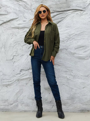 Olive green corduroy button-up overshirt with a chest pocket, worn open over a black tank top.