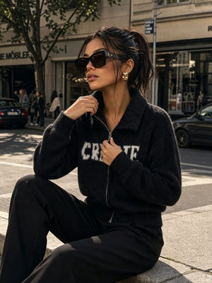 Black cardigan with zip-front and letter graphic