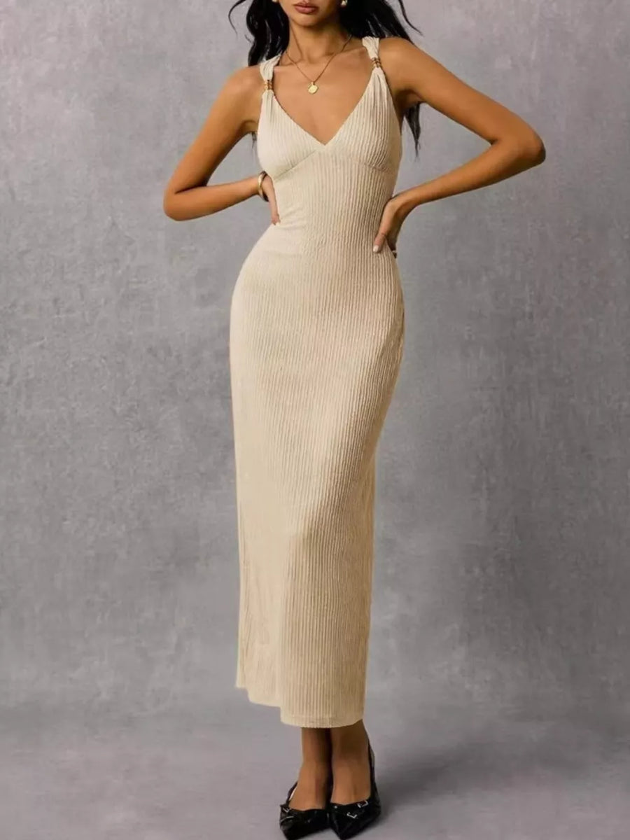 Ivory ribbed midi dress with V-neck and gold ring strap detail.