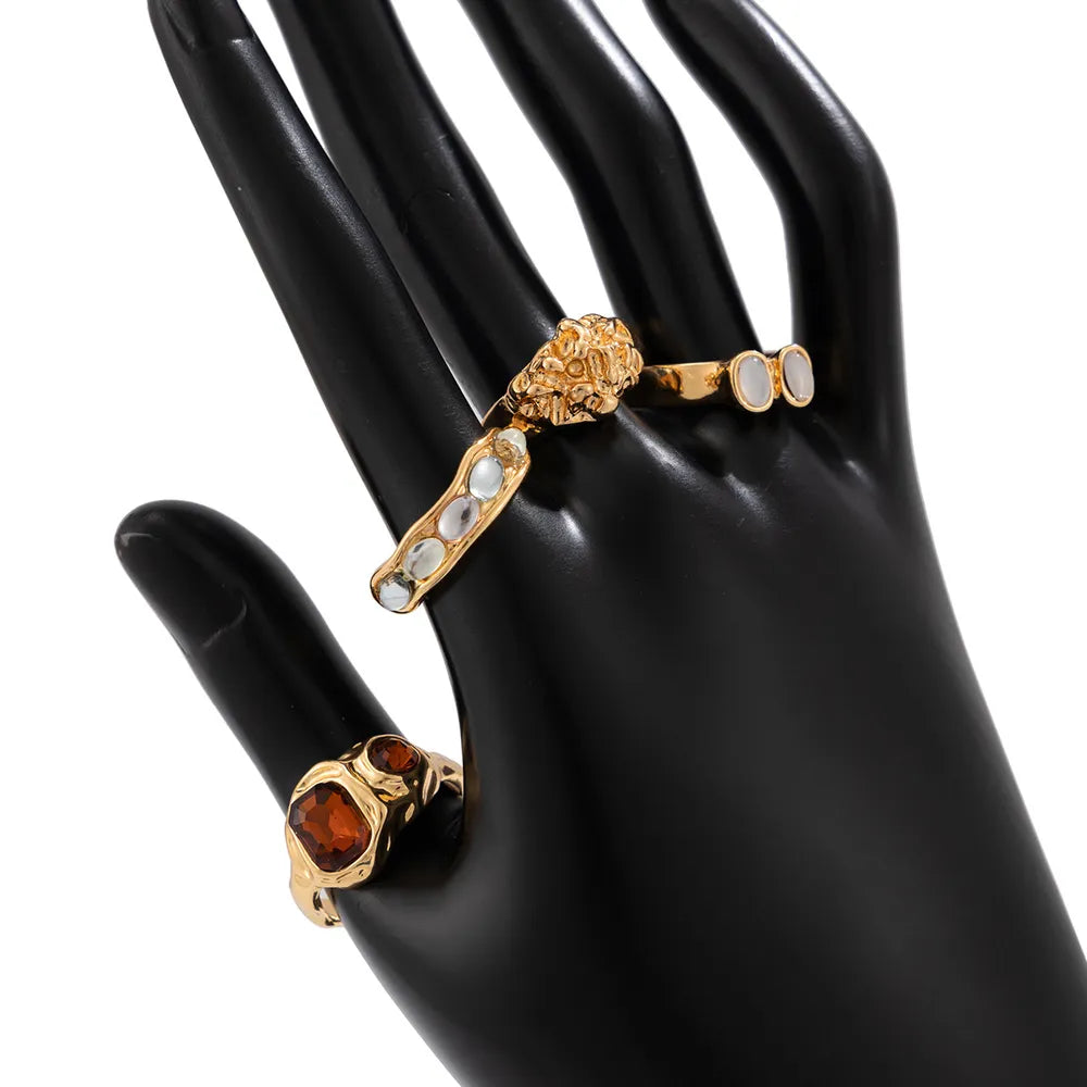 18K Gold-Plated,Stainless Steel,Rhinestone Care instructions: Avoid wearing duri ring in red with fitted silhouette