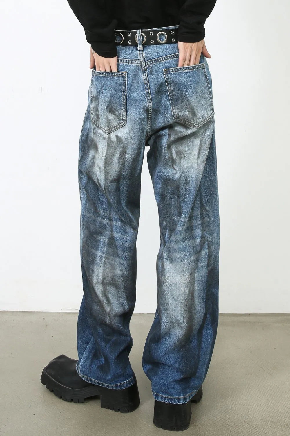 Faded ombre wide-leg jeans in medium blue denim with a distressed wash.