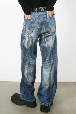 Faded ombre wide-leg jeans in medium blue denim with a distressed wash.
