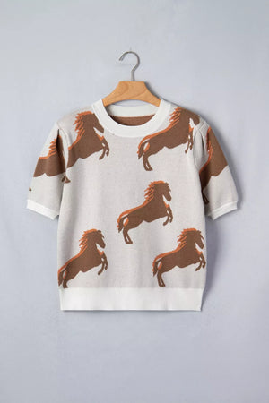 Beige knit sweater with all-over brown horse print and puff sleeves.