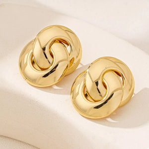 Chunky knot gold-plated earrings with interlocking links.