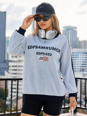 Light gray cotton sweatshirt with graphic print and varsity stripes on sleeves.