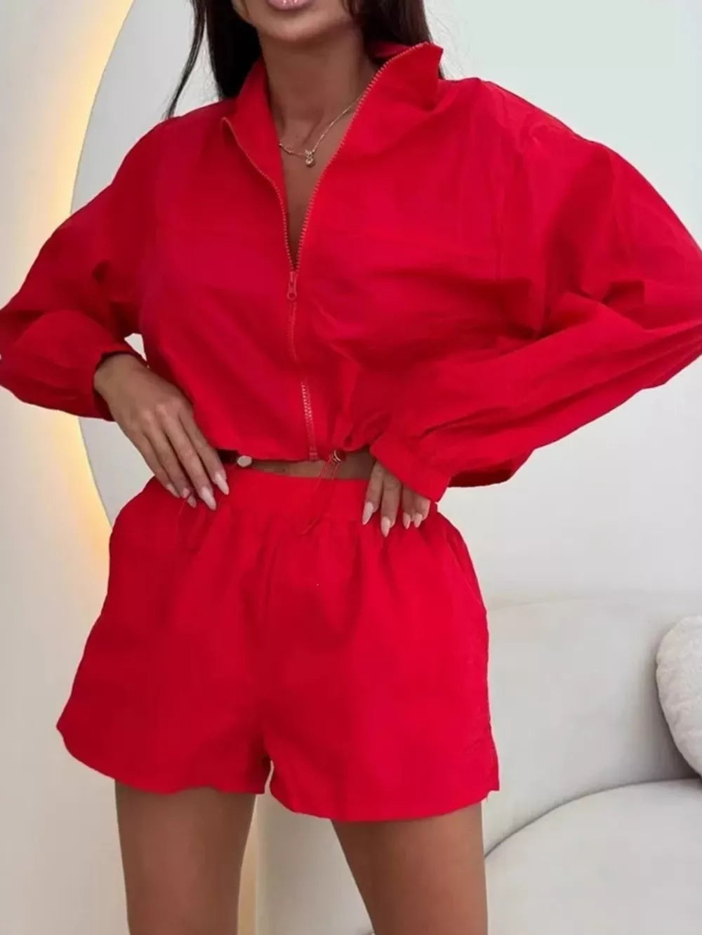 track jacket in red featuring pocketed and relaxed fit