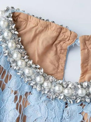Blue lace dress with pearl and crystal embellished neckline detail