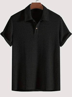Black textured polo shirt with rolled sleeve detail and button placket.