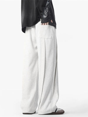 Men's loose fit drawstring pants in Flower White with a back pocket and pleated detail.