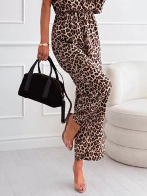 Leopard print wide-leg romper with elastic waist and side pockets.
