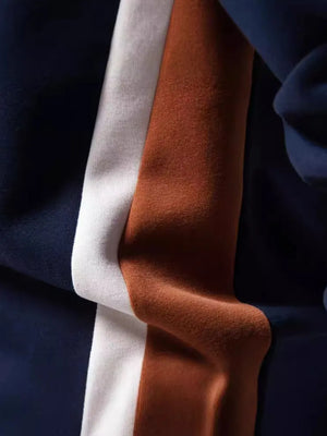 Crew neck sweatshirt with navy, white, and terracotta color block side panels.