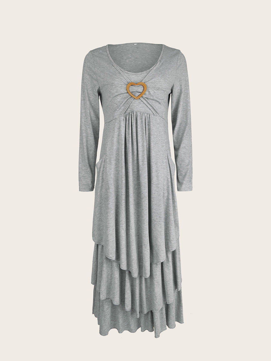 Light gray long sleeve midi dress with tiered hem and heart detail at neckline.