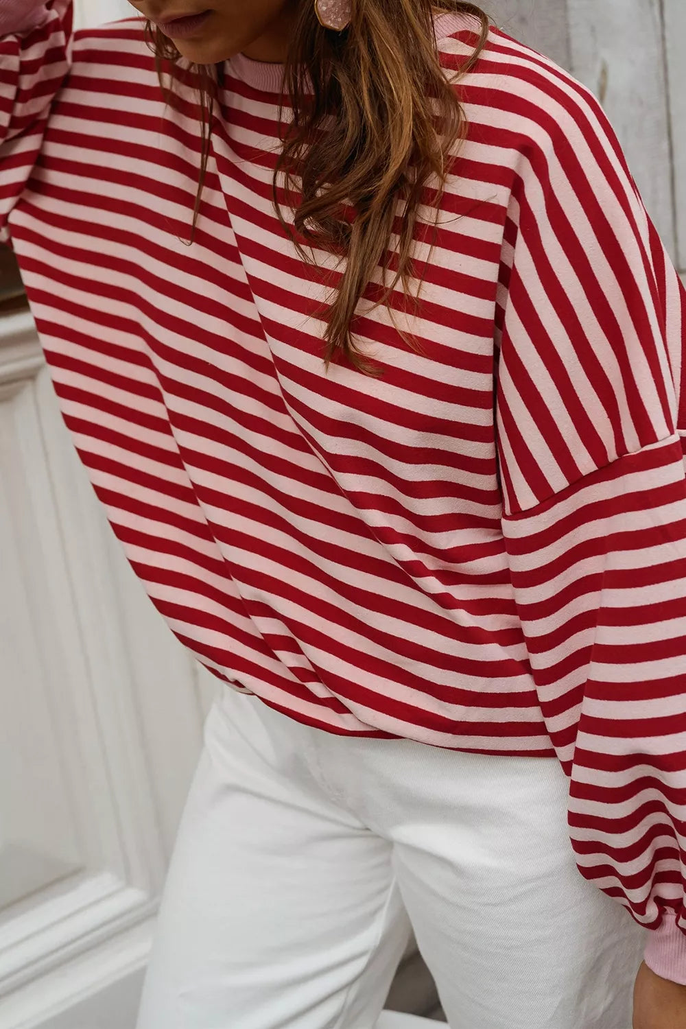 95% polyester, 5% elastane Care instructions: Machine wash cold sweatshirt in Stripe with relaxed silhouette
