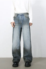 Faded gradient wide-leg jeans in medium wash denim with a relaxed fit.
