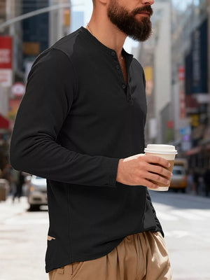 Men's black long sleeve Henley t-shirt with button placket and ribbed texture detail.