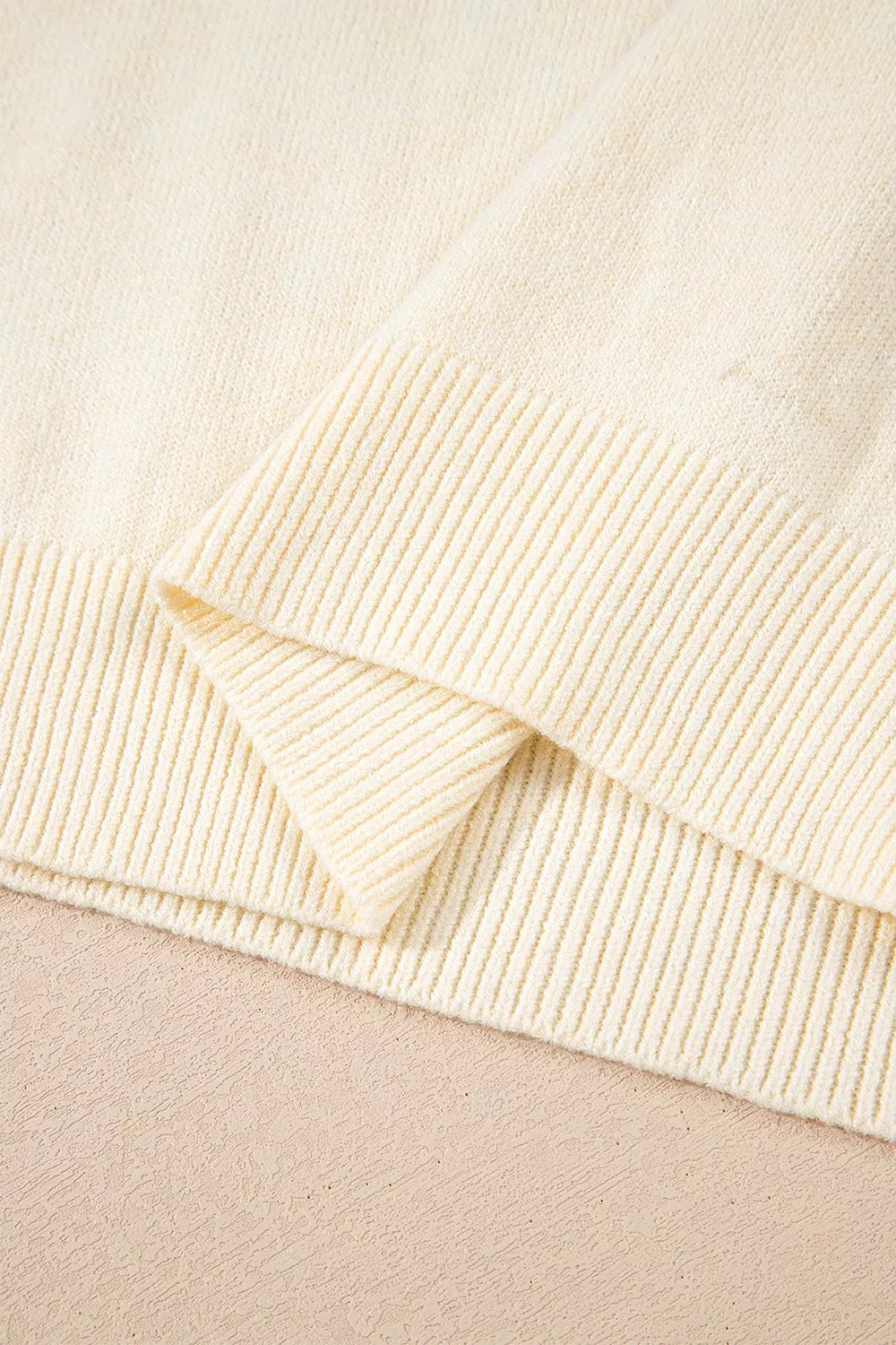 Button-cuff Crew Neck Sweater in ivory with decorative buttons