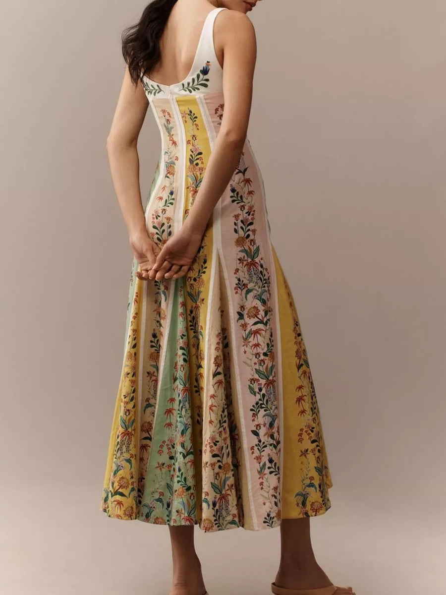 Botanical print sweetheart maxi dress with sweetheart neckline and paneled skirt in cotton.