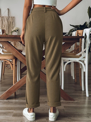 Black straight-leg pants featuring buttoned and corduroy