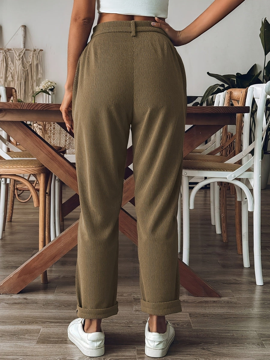 Black straight-leg pants featuring buttoned and corduroy
