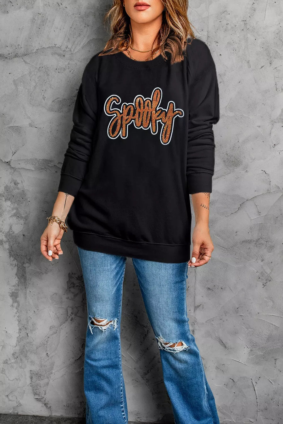 black sweatshirt with rhinestone embellishment and long sleeve