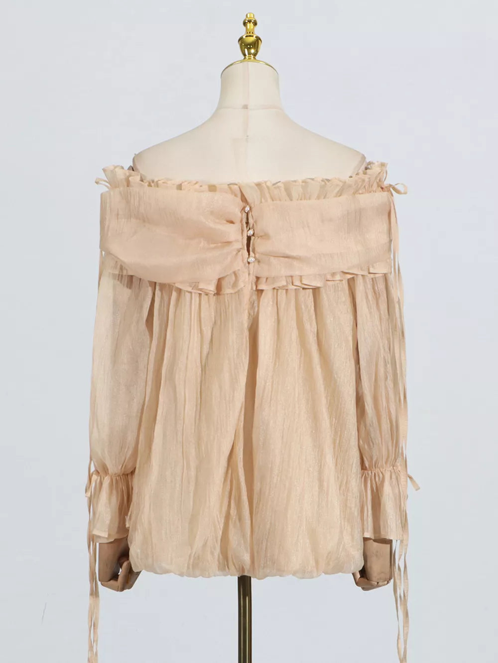 Champagne off-shoulder ruffled maternity blouse with button back and tie sleeves