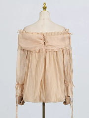 Champagne off-shoulder ruffled maternity blouse with button back and tie sleeves