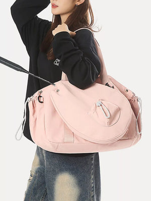Pink athletic nylon tote bag with racket holder and cinch-cord closure.