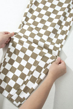 Maternity barrel pants in brown and white checkered cotton with cargo pockets.