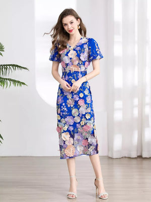Blue floral embroidered midi dress with short sleeves and V-neck.