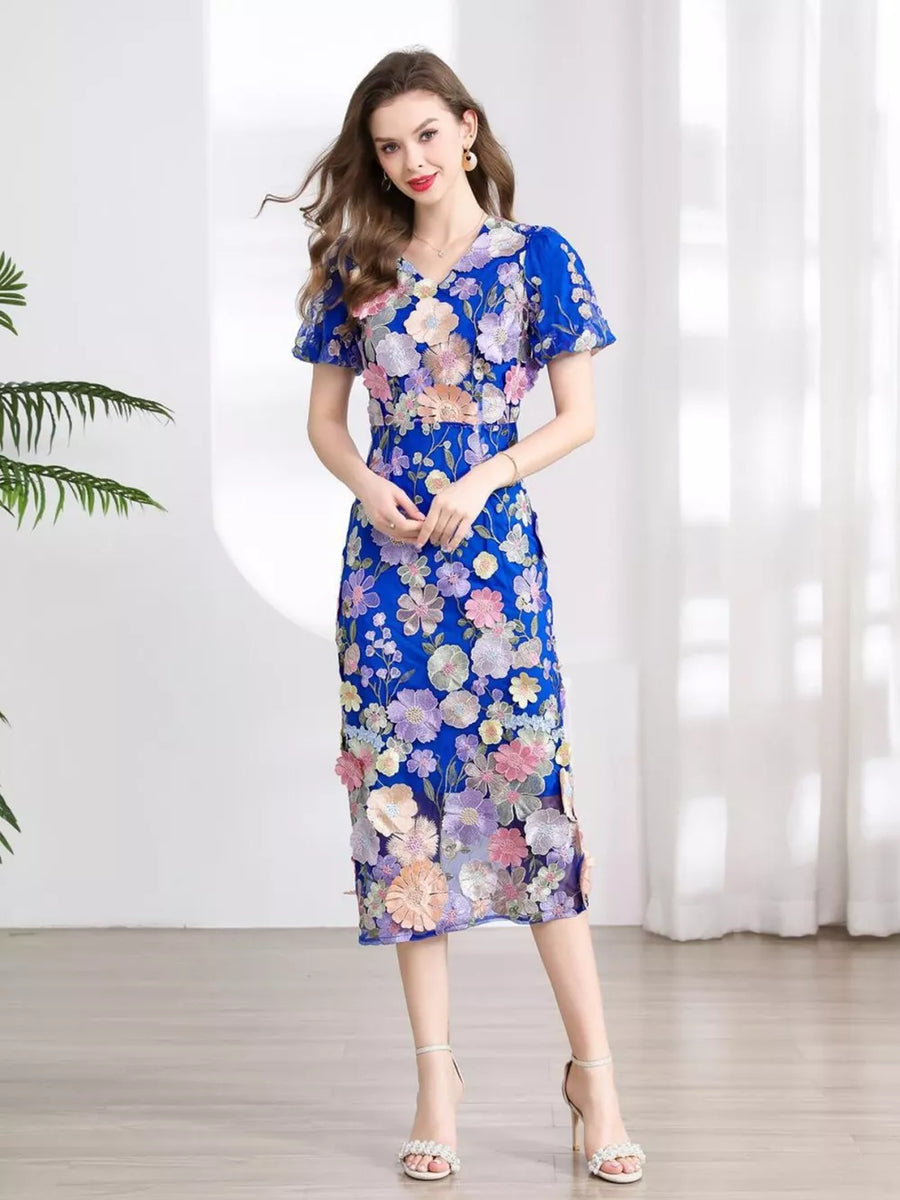 Blue floral embroidered midi dress with short sleeves and V-neck.