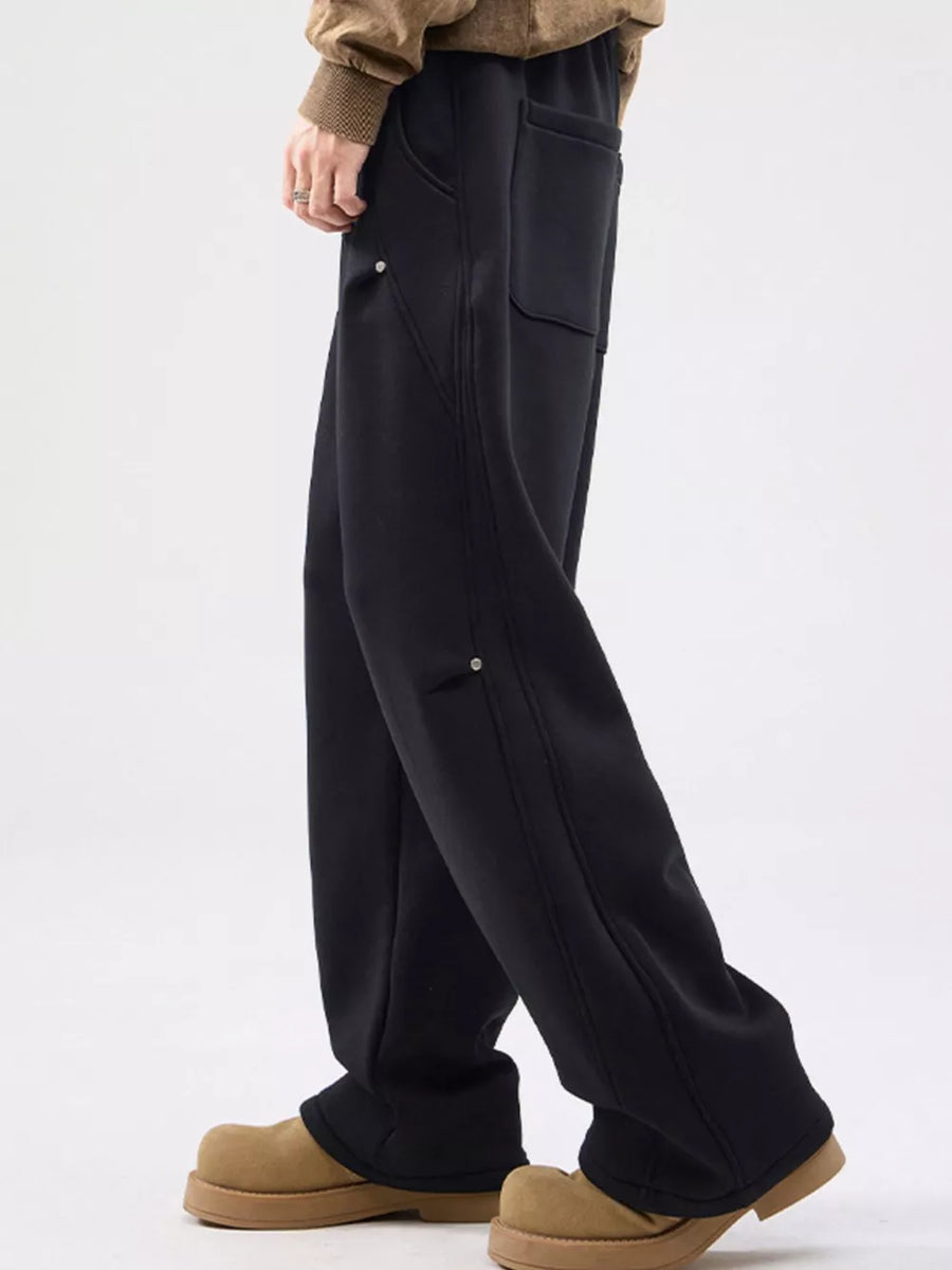 Black casual loose-fit sweatpants with pockets and drawstring detail.