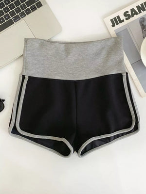 Black jogger shorts with gray contrast trim and waistband.