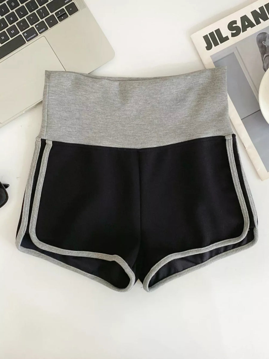 Black jogger shorts with gray contrast trim and waistband.